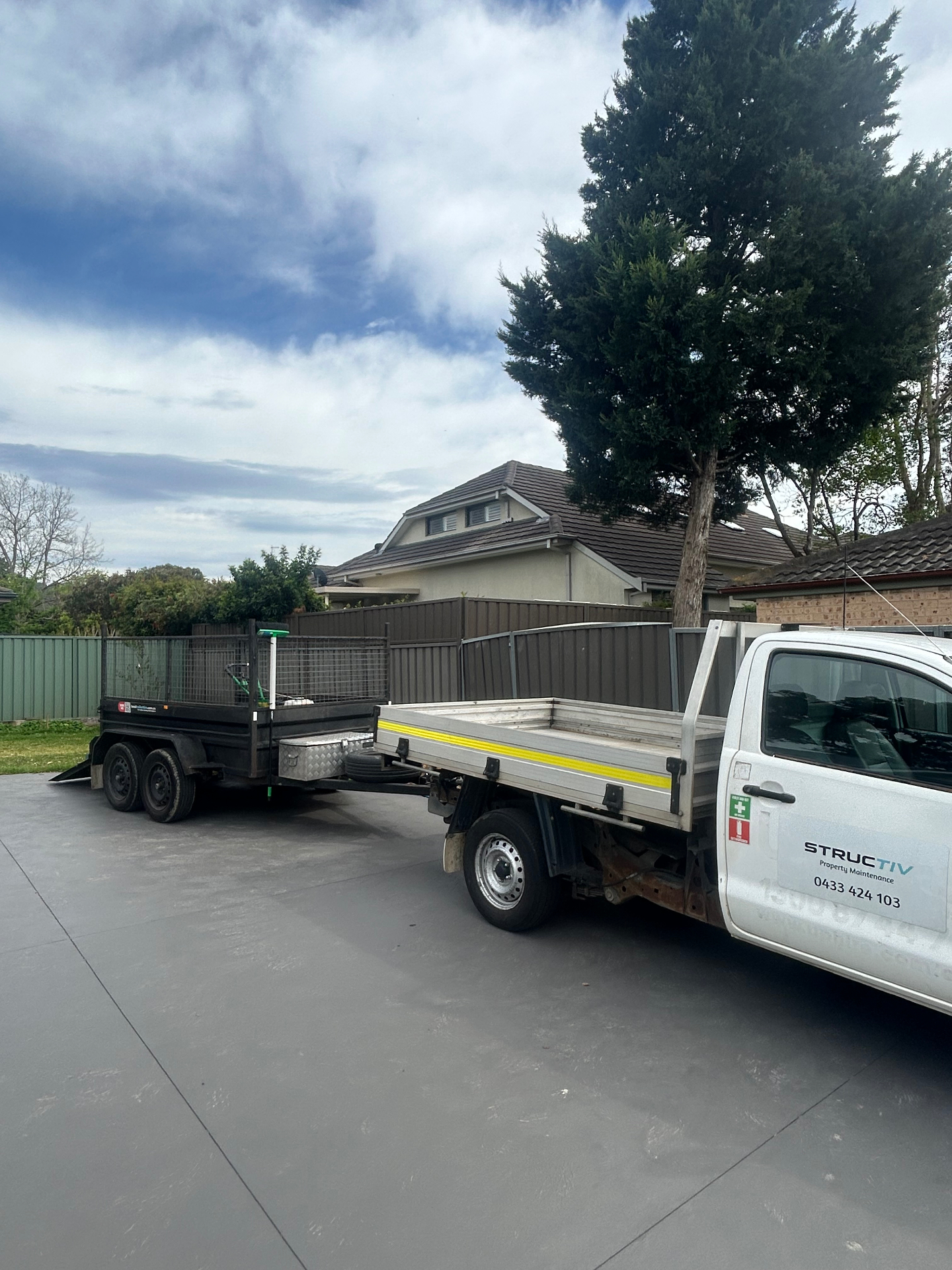 The Structiv ute and trailer parked at a job in Sydney