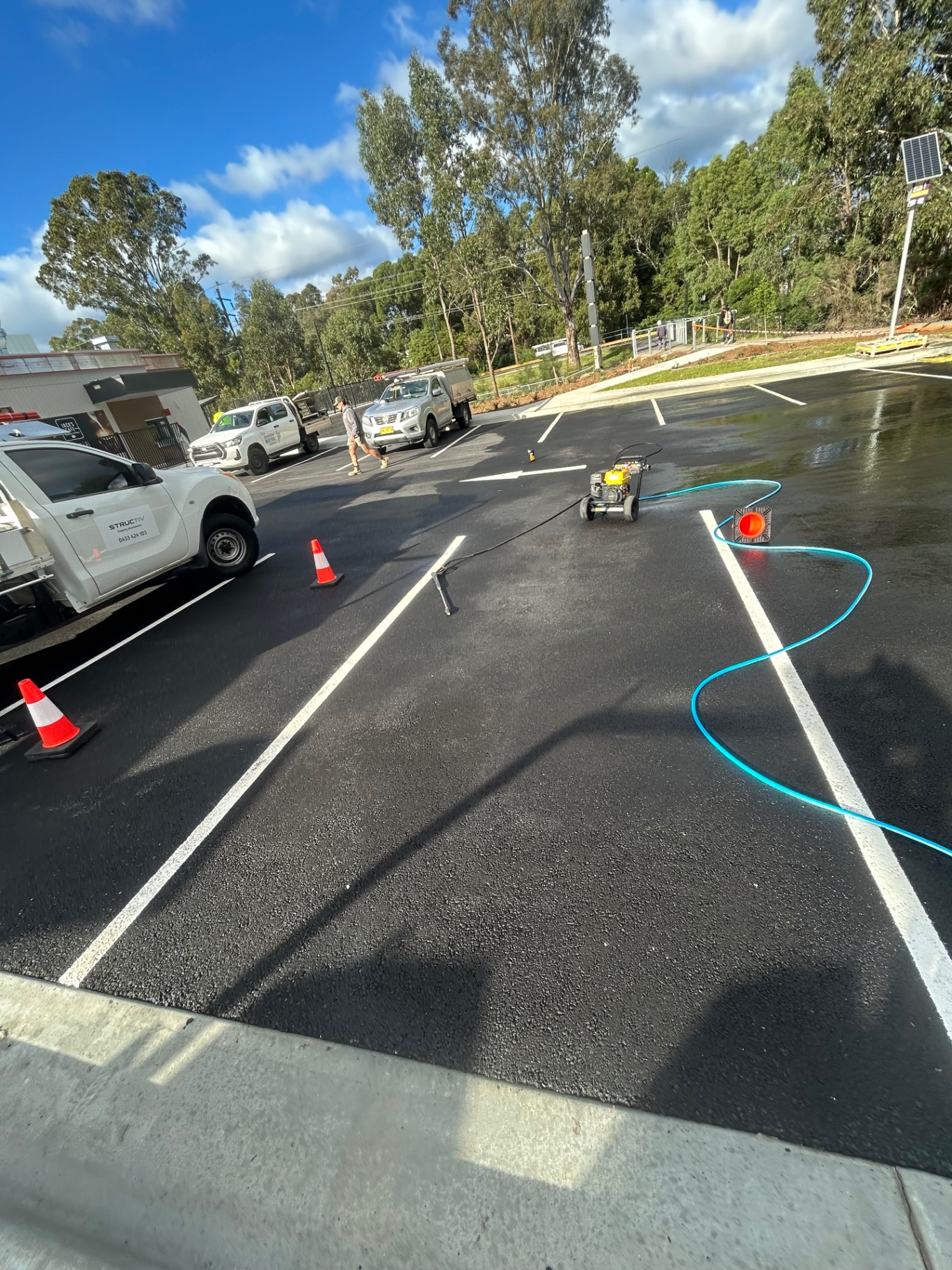 A freshly cleaned asphalt car park with markings visible